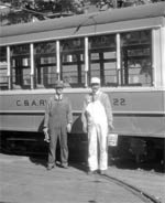 Dobbs and Buck by a railcar